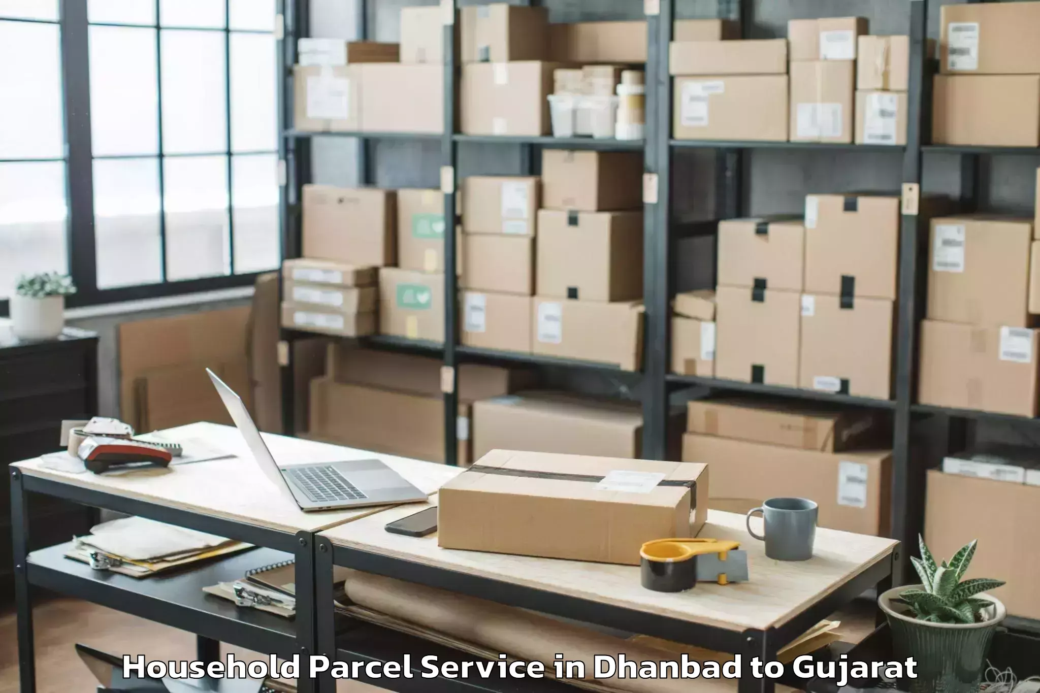 Top Dhanbad to Balasinor Household Parcel Available